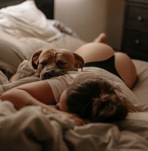 dog and lady in bed
